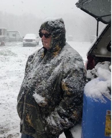 A fast-moving snowstorm held up start on Thursday morning until 10 a.m. Bird Planter Norm Meeder waits for the snow to stop.